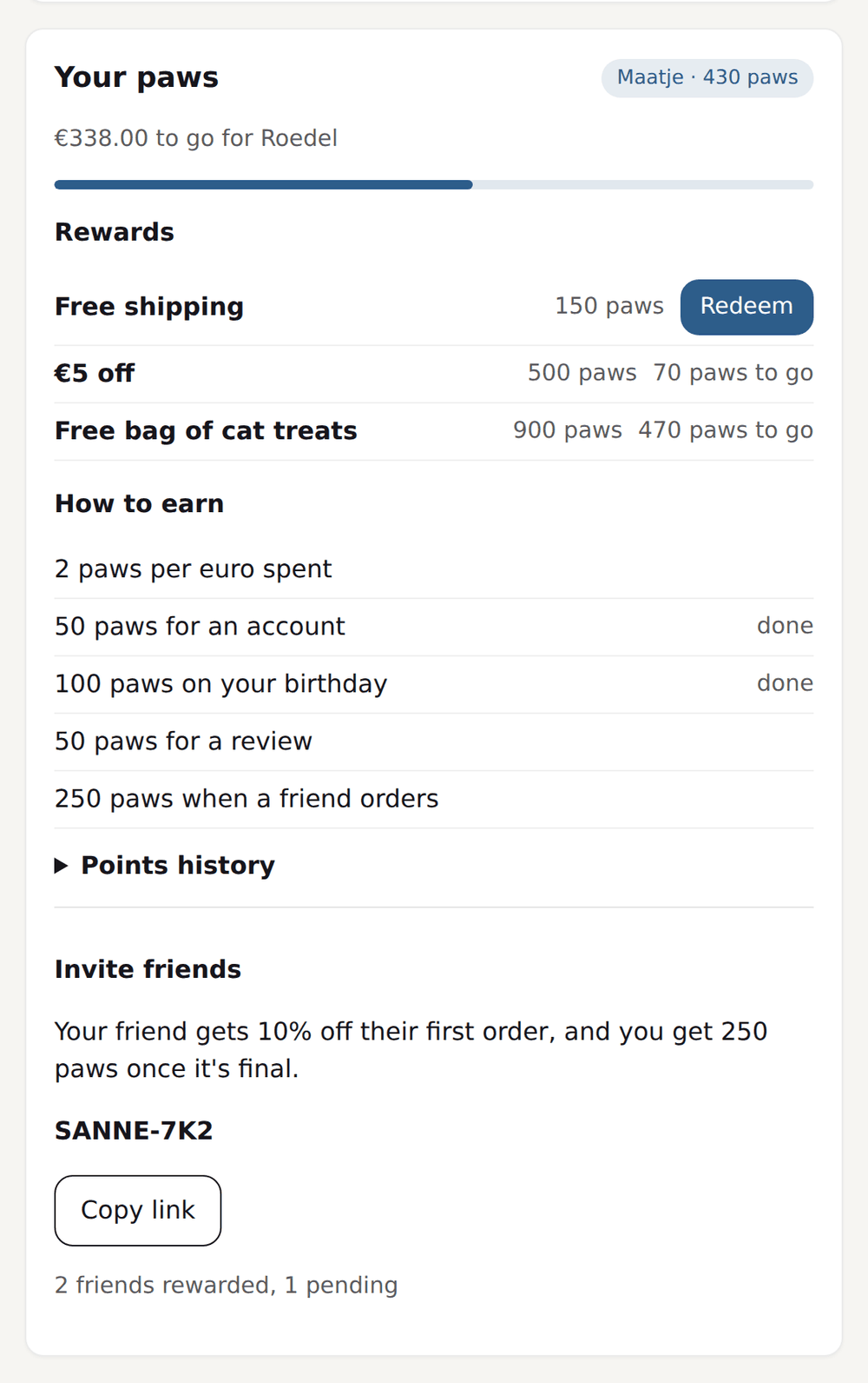 Customer portal of a pet store with the point balance in 'paws', the tier, the rewards and the ways to earn